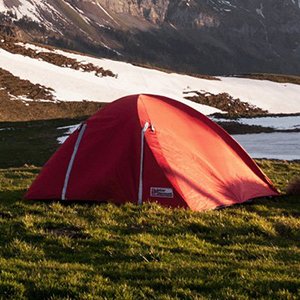 Couple enjoying camping gear in the mountains