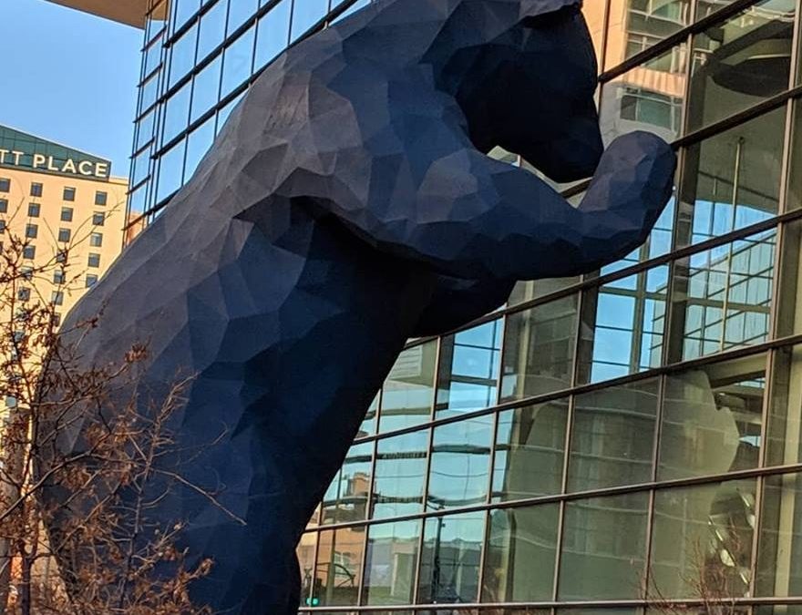 Statue of a Bear looking in the Denver Convention Center