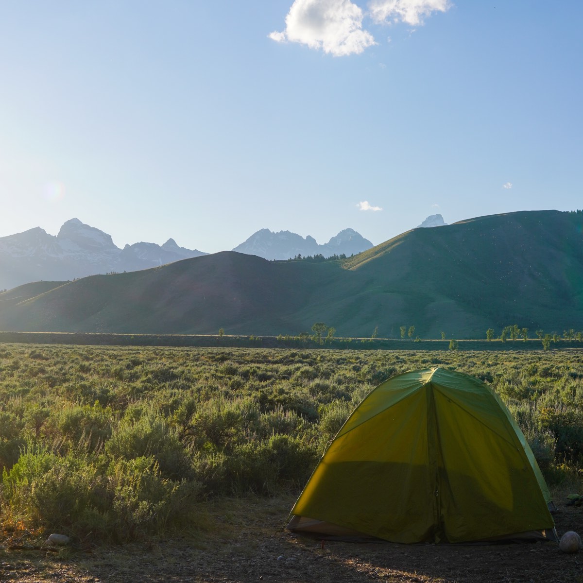 Tent in front of mountain range